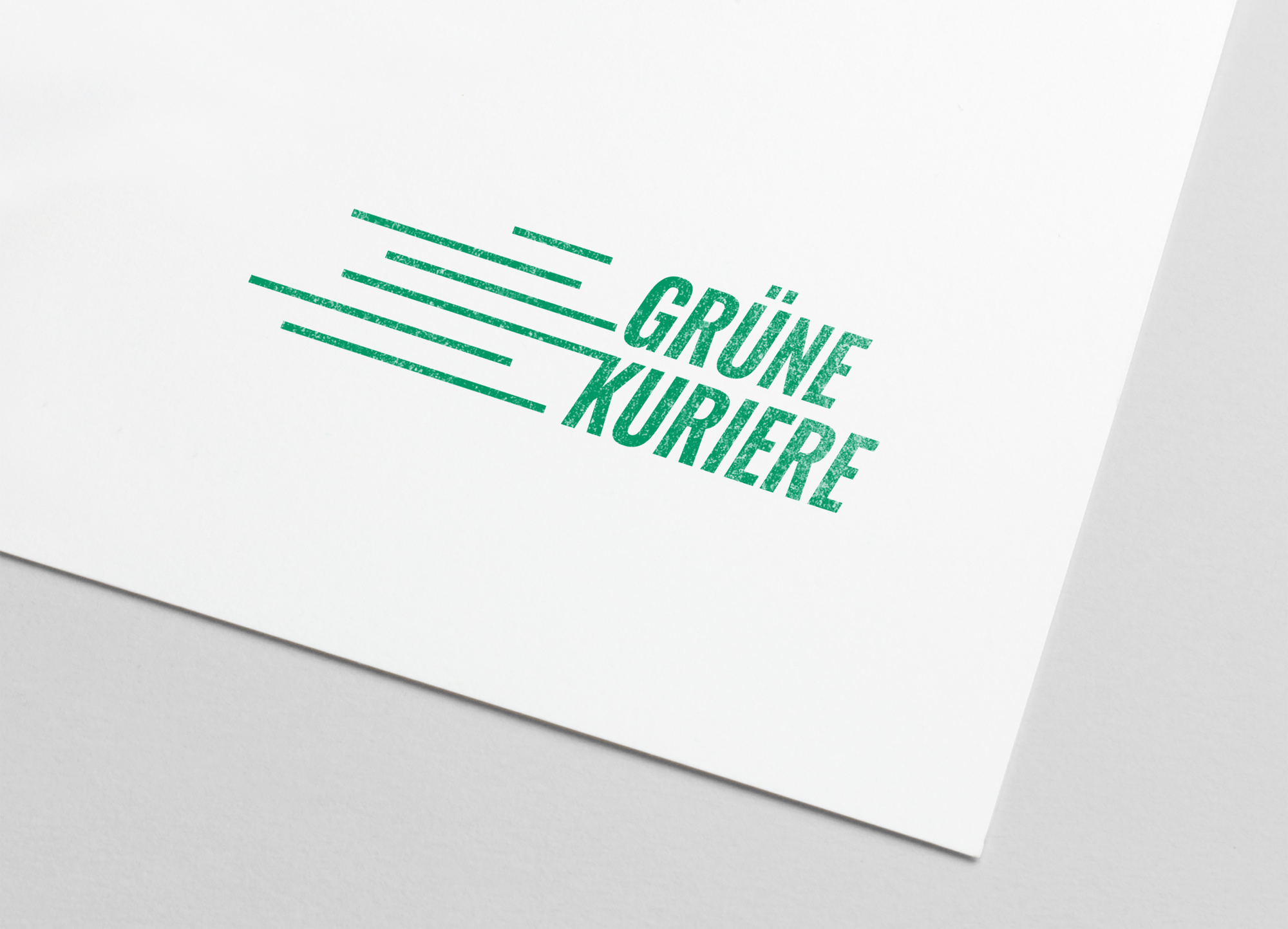 Das Logo der Grünen Kuriere auf Papier gestempelt